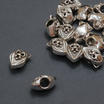 Kovový korálek s motivem Lev Pandora, rozměr 12,5×8 mm, dírka 4 mm, balení 20 g 15 ks (±)