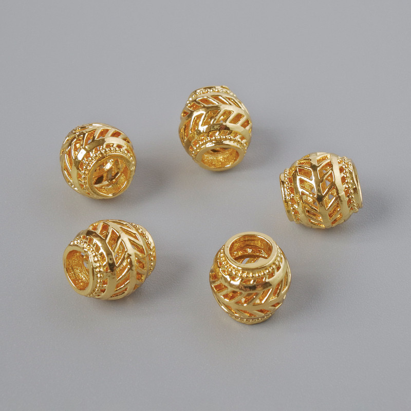 Bižuterní korálka-vložka, průměr 7×7 mm, otvor 3–4 mm, zlatistá barva kovu, 1 ks