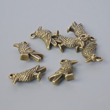 Přívěsek 'Ptáček', průměr 18×13 mm, průměr dírky 1,9 mm, balení 7 ks ±, bronzová barva kovu