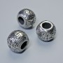 Kovová korálka-vložka, průměr 10×13 mm, díra cca 5–6 mm, stříbrná barva kovu, 1 ks