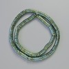 Rondelové korálky hematitu, barva chameleon zelená, průměr 6×2 mm, délka 42 cm na niti