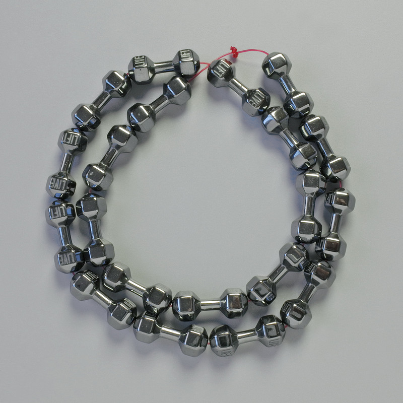 Korálky hematit černé, tvar činky, průměr 21×7 mm, délka cca 42 cm, na niti