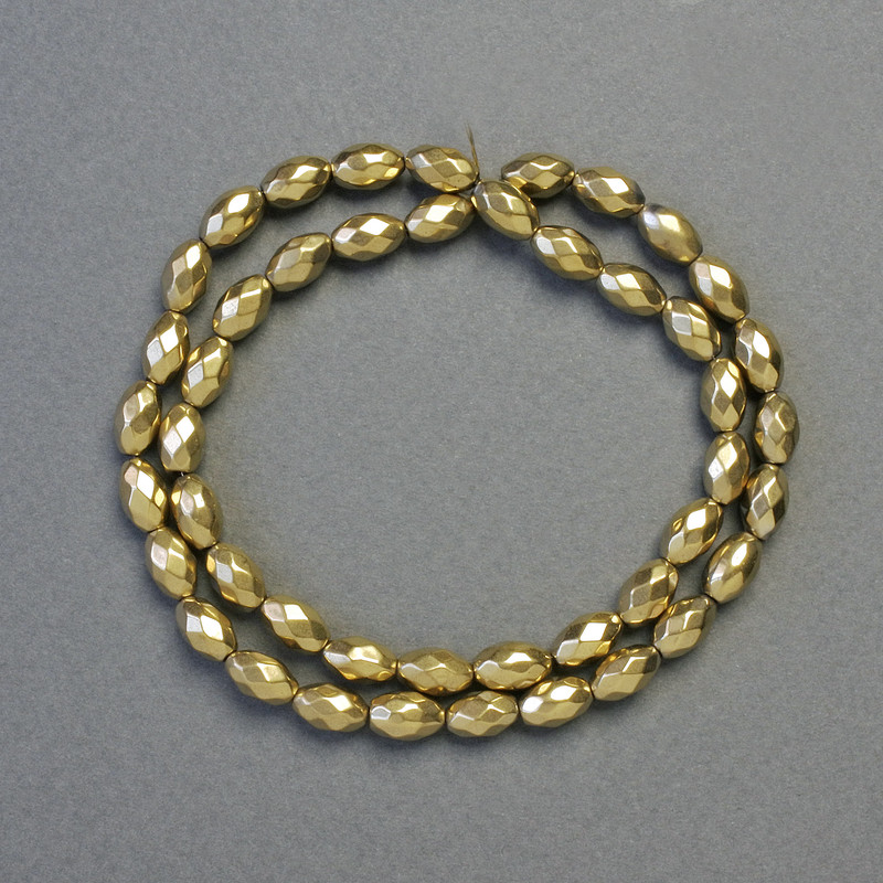 Hematitové korálky broušené oválné zlaté barvy, průměr 5×8 mm, délka cca 41 cm, šňůra