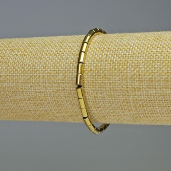 Náramek z hematitu cylindrického tvaru, zlatá barva, průměr 6×4 mm, délka 18 cm, pružný