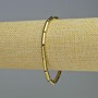 Náramek z hematitu cylindrického tvaru, zlatá barva, průměr 12×4 mm, délka 18 cm, elastický