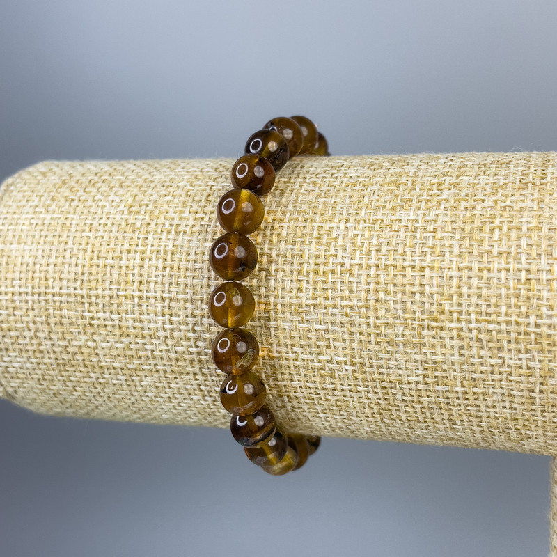 Náramek z jantarových hladkých korálků 6 mm ±, délka 18 cm, elastické provedení (stretch)