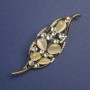 Brož List Kočičí oko, bílé štrasové kamínky, zlatistý kov, 64 × 24 mm+
