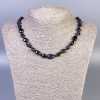 Náhrdelník ze sokolího oka, briliantně broušené korálky, průměr 9–13×9 mm, délka cca 50 cm, s zapínáním
