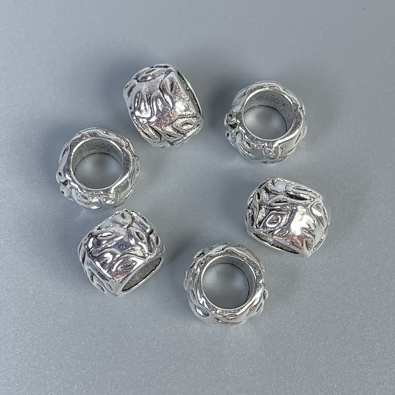 Bižuterní komponenty – vložená korálka, barva kovu stříbrná, průměr 10×8 mm ±, díra cca 6 mm, balení 20 g (~10 ks)