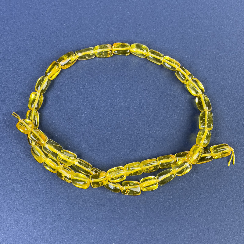 Jantarové fasetované korálky 10×7 mm na niti, délka 39 cm+
