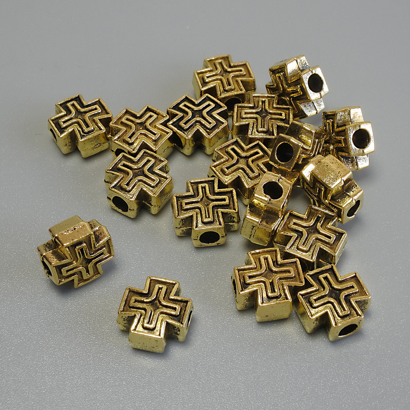 Korálka-vložka ve tvaru kříže, zlatá barva kovu, průměr 9×9×4,5 mm, otvor 2,8 mm, balení 20 g (~18 ks)