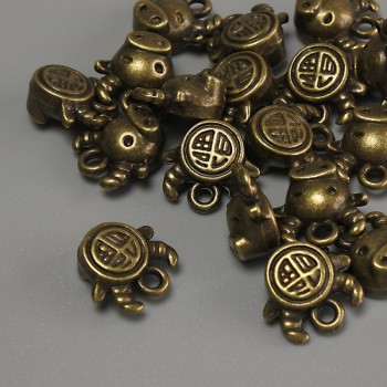 Přívěšek Býk – bronzová barva kovu, rozměry 10×9×5 mm ± otvor 1 mm ± balení 20 g (~17 ks)