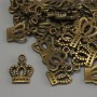 Přívěsek Koruna, bronzová barva, rozměry 15×10×1 mm ± otvor 2 mm ±, balení 20 g (~36 ks)