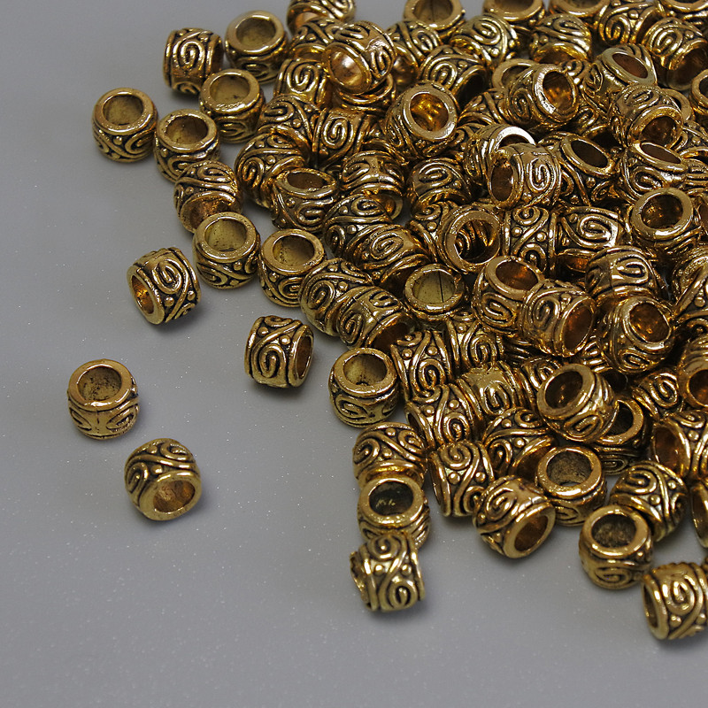 Zlatá korálka-vložka, průměr 4×3 mm, otvor cca 2,5 mm, balení 20 g (~155 ks)