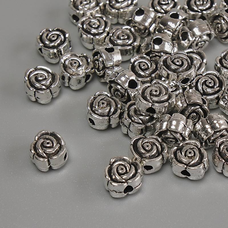 Korálková vložka «Květina» – stříbrná barva kovu, průměr 6×4 mm ±, otvor průměru cca 1,7 mm ±, balení 20 g (~37 ks)