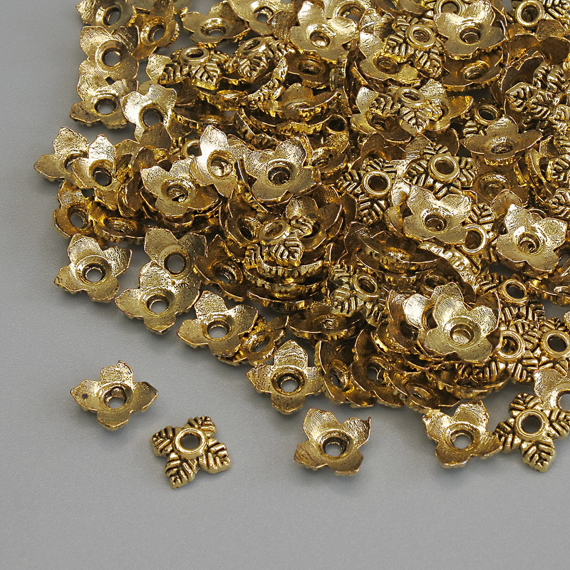 Korálková čepička, zlaté barvy kovu, průměr 5×1 mm ±, otvor 1 mm ±, balení 20 g (~160 ks)