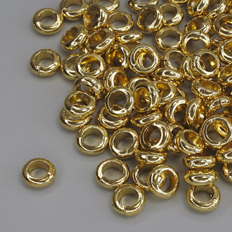 Bižuterní komponenta – korálková vložka, zlatá barva kovu, průměr 6×2,5 mm, otvor cca 3,5 mm, balení 20 g (~93 ks)