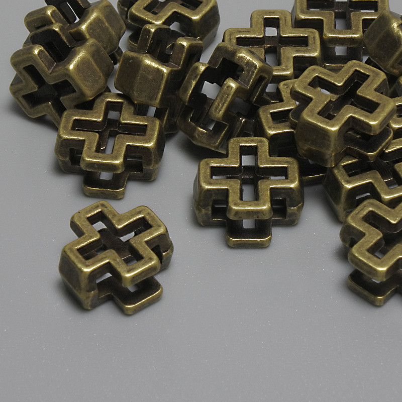 Furnitura korálka-vložka ve tvaru kříže, bronzová barva, rozměry 10×10×5 mm, otvor o průměru 5 mm, rozměr 7×2 mm, balení 15 ks