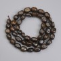Korálky bronzitu brusované 6–11×5,5 mm ±, délka 40 cm ± na niti