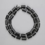Korálky z černého turmalínu broušené, průměr 8–10×6 mm, 5–7 mm ±, navlečené na niti