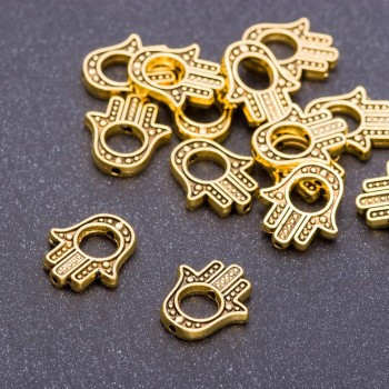 Korálková vložka ve tvaru dlaně, barva staré zlato, rozměry 14×12×2,5 mm, otvor 5 mm, balení 20 g ± 19 ks