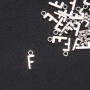 Kovové komponenty – Přívěsek písmeno 'F' 17×7 mm, balení 20 g (+/- 30 ks)