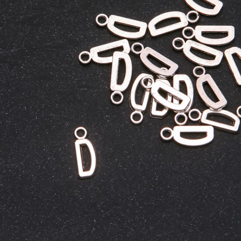 Přívěšek – písmeno D, 17×7 mm, balení 20 g (± 25 ks)