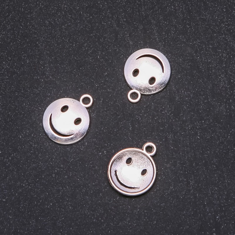 Kovové komponenty – přívěšek Smajl 15×18 mm balení 20 g ± 20 ks