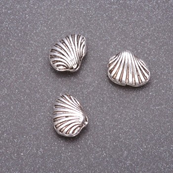 Bižuterní součástka – vložka do korálky, průměr 10×9 mm, vnitřní průměr cca 1,5 mm, hmotnost 20 g ±16 ks