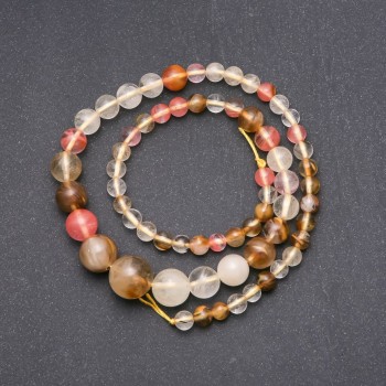 Korálky kalcedonu – polotovar, hladké kuličky postupně zvětšující se, průměr 6–14 mm, délka 44 cm