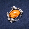 Brožka jantarová (umělý jantar) 47 × 38 mm, barva žlutá, kov stříbrný