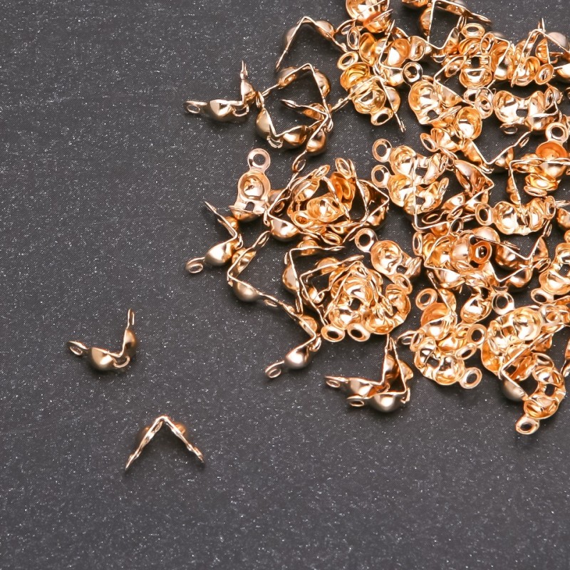 Příslušenství – žabka na korálky, zlatý kov, 7×4 mm (±), balení 10 g (±), 140 ks