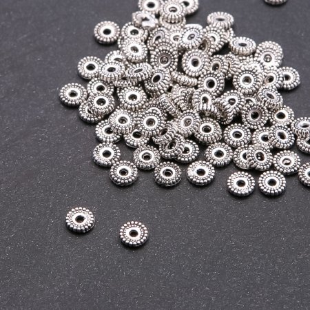 Konektor – rozdělovací vložka pro korálky, průměr 6 mm, díra 1,5 mm, balení 20 g ± 110 ks