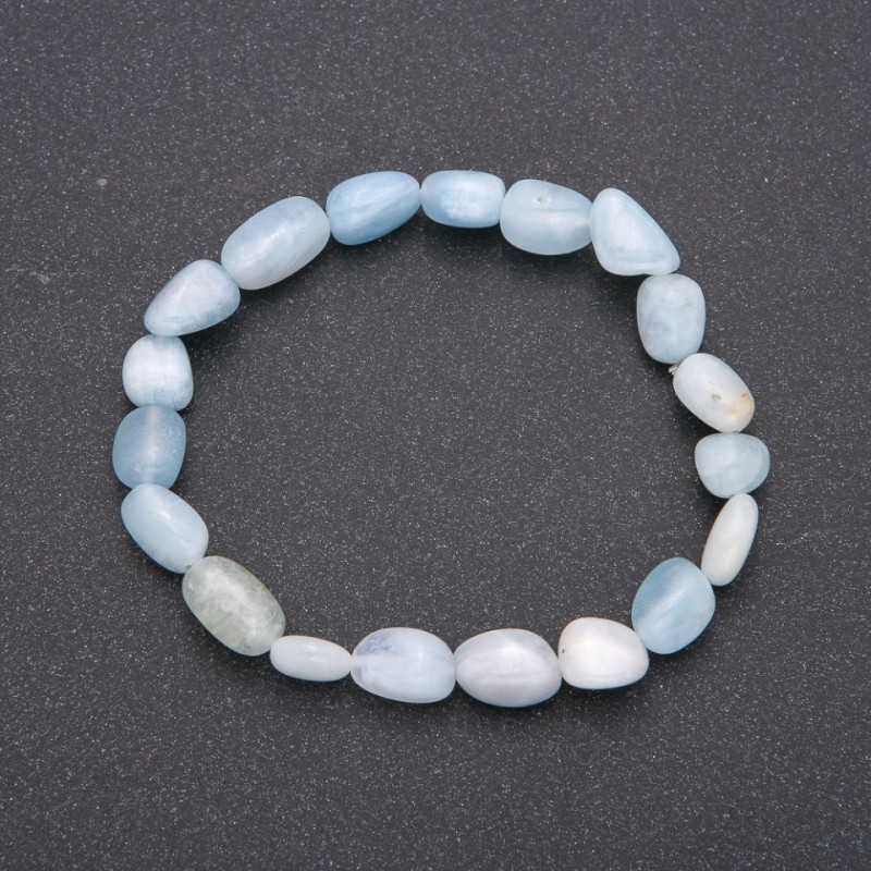 Náramek z přírodního akvamarínu na elastické gumičce, facettování, průměr 7×10(±) mm, obvod 18 cm