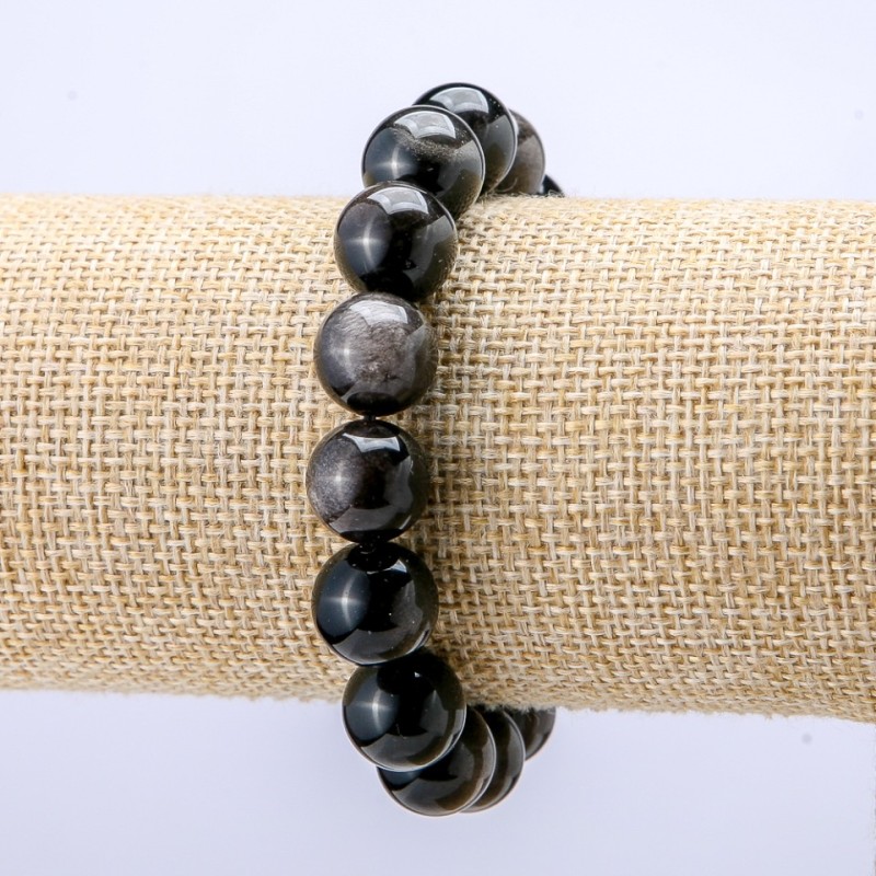 Náramek z obsidiánu se stříbřitým leskem, hladké kuličky o průměru 12 mm, délka 18 cm +