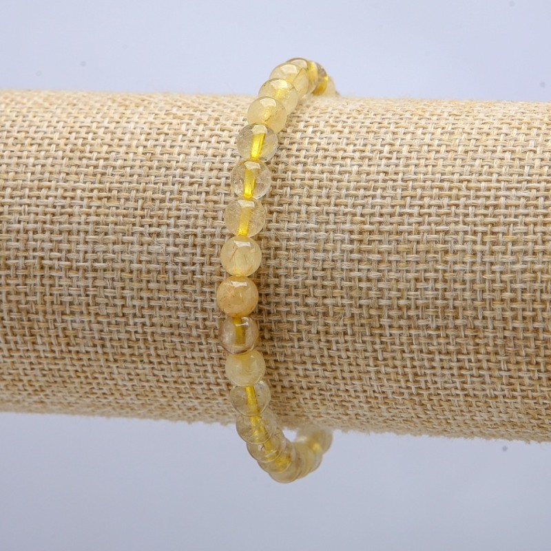 Náramek na gumičce z rutilitového křemene, hladké kuličky o průměru 6 mm, obvod cca 18 cm
