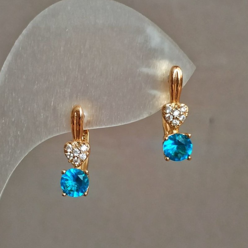 Náušnice Xuping pozlacené 18K se bílými štrasami a modrým krystalem, průměr 16×5 mm
