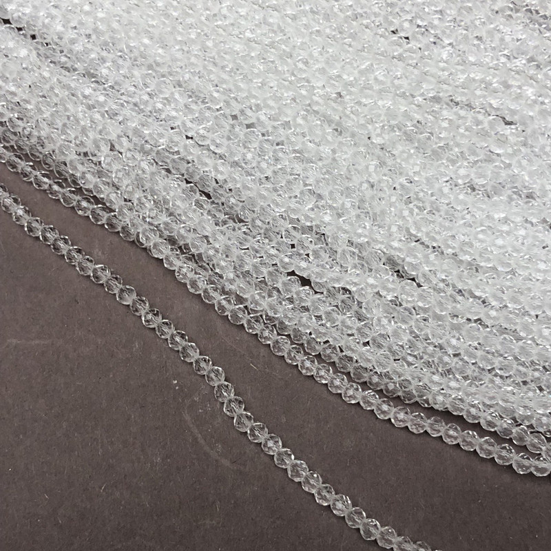 Korálky Český křišťál na niti bílé průhledné broušené rondelové, průměr 3,5×3 mm +-, délka 36–38 cm +