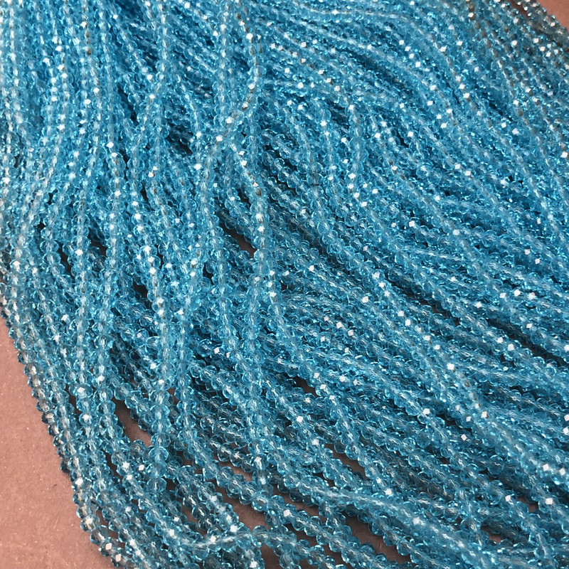 Korálky Český křišťál na vlascu modré průhledné broušené rondely, průměr 3×2,5 mm + -, délka 36–38 cm +