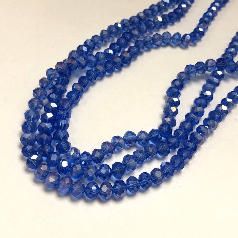 Korálky Český křišťál na niti modré průhledné s benzínovým leskem, brusovaný rondel, průměr 8×6 mm, délka 40–42 cm
