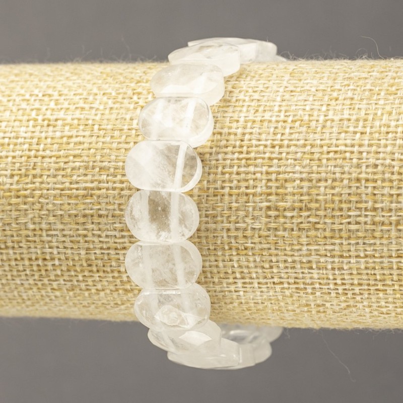 Náramek na gumičce z přírodního kamene — horský křišťál, fazetovaný článek, průměr cca 14 × 9,5 mm