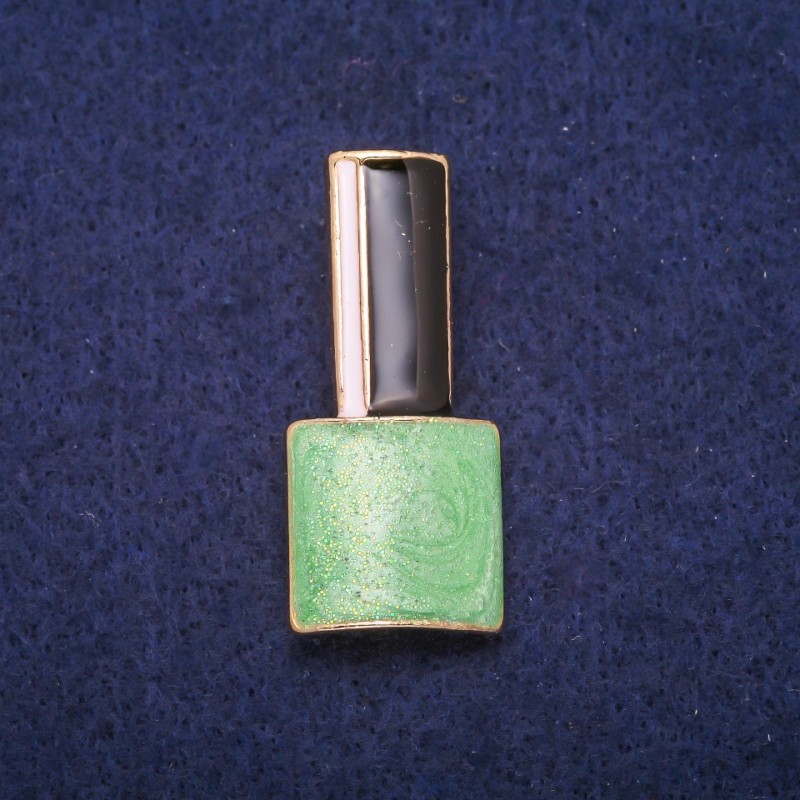 Brožka „Lak“ zelený, černý a bílý smalt, zlatý kov 18×39 mm