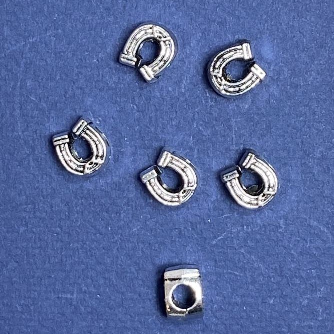 Pandora korálek podkova 9×11 mm, průměr 5 mm, fasetovaný 20 g ±9 ks