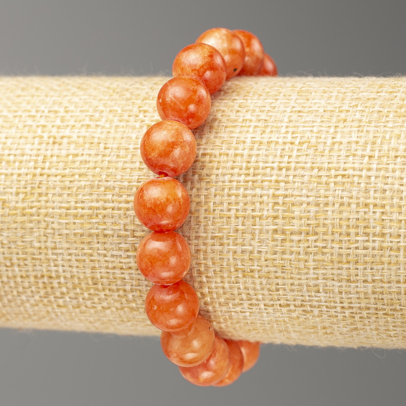 Náramek na gumičce karneol (umělý akryl) hladká korálka, průměr 10 mm, délka 18 cm ±