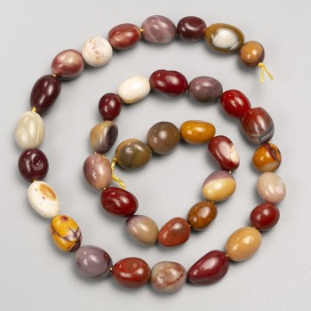 Korálky z kamene jaspis Mookaite galutování na niti, průměr 10×12 mm, délka cca 40 cm