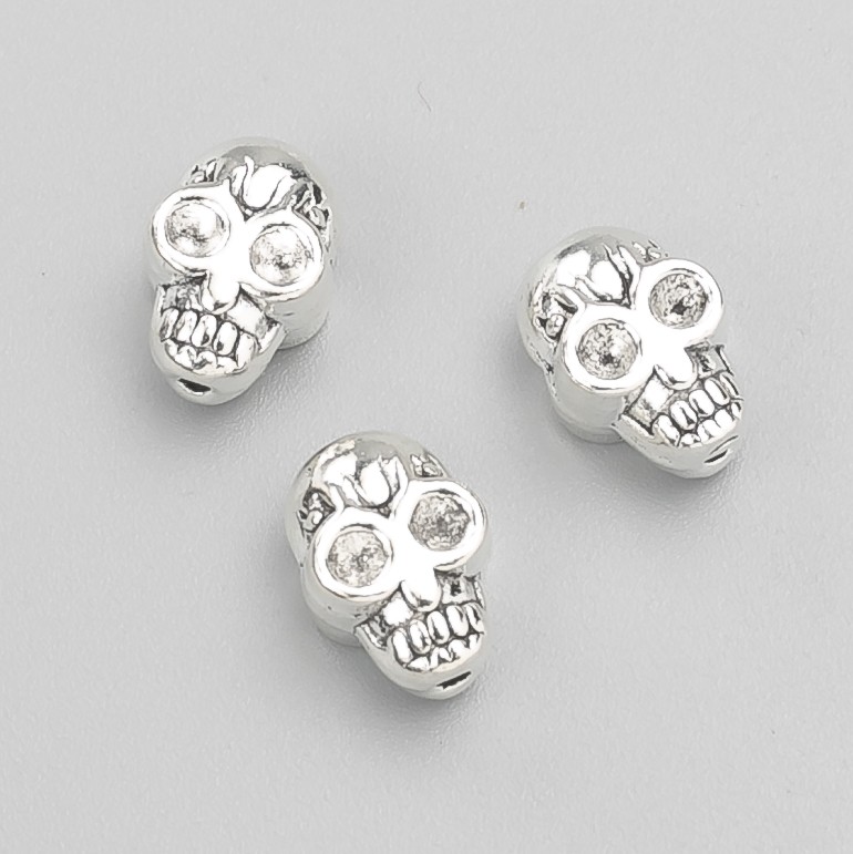 Korálková vložka s lebkou, průměr 11×8×6 mm, balení 20 g, 11 ks ±, barva kovu: stříbrná