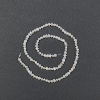 Říční oválné perly na niti, průměr 6×5 mm, délka cca 35 cm