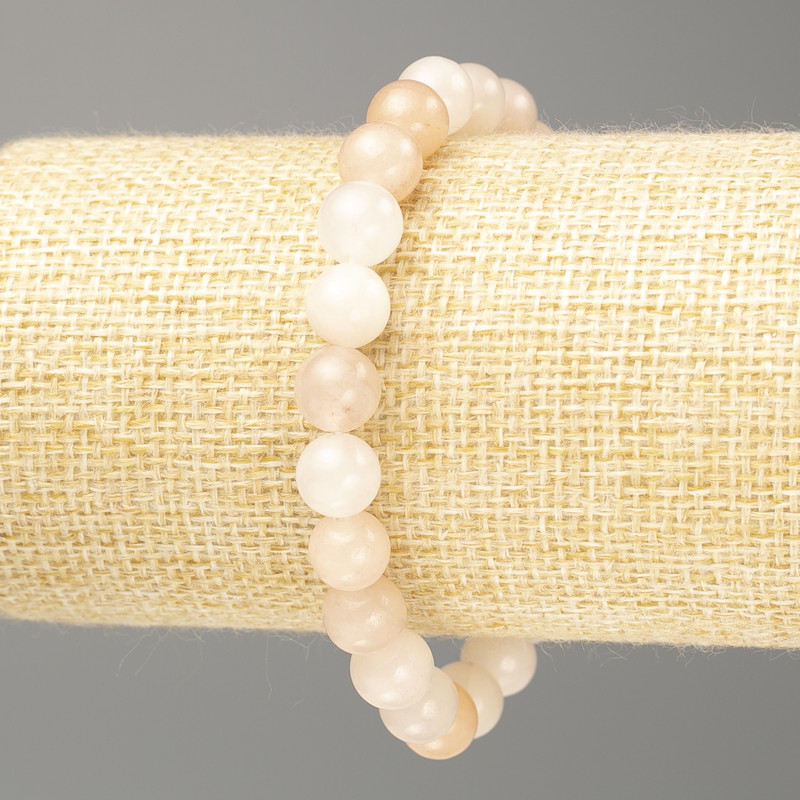 Náramek selenit (syntetický akrylát) – hladké korálky o průměru cca 8 mm, délka 18 cm (elastický)