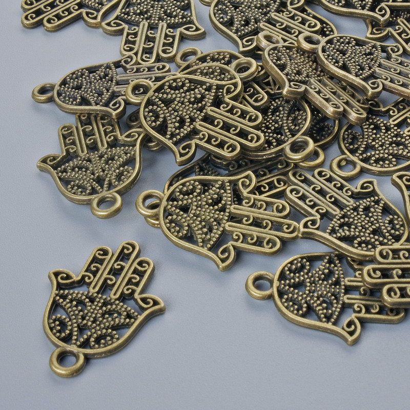 Přívěšek „Hamsa“, bronzová barva kovu, průměr 21×15 mm, otvor 1,7 mm, balení 24 ks ±