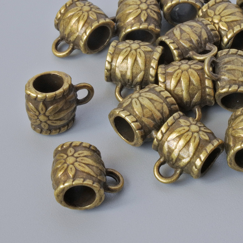 Držák bailu, průměr 8×6 mm, průměr otvorů 1,7 mm a 4 mm, délka 10 mm, balení 18 ks, bronzová barva kovu